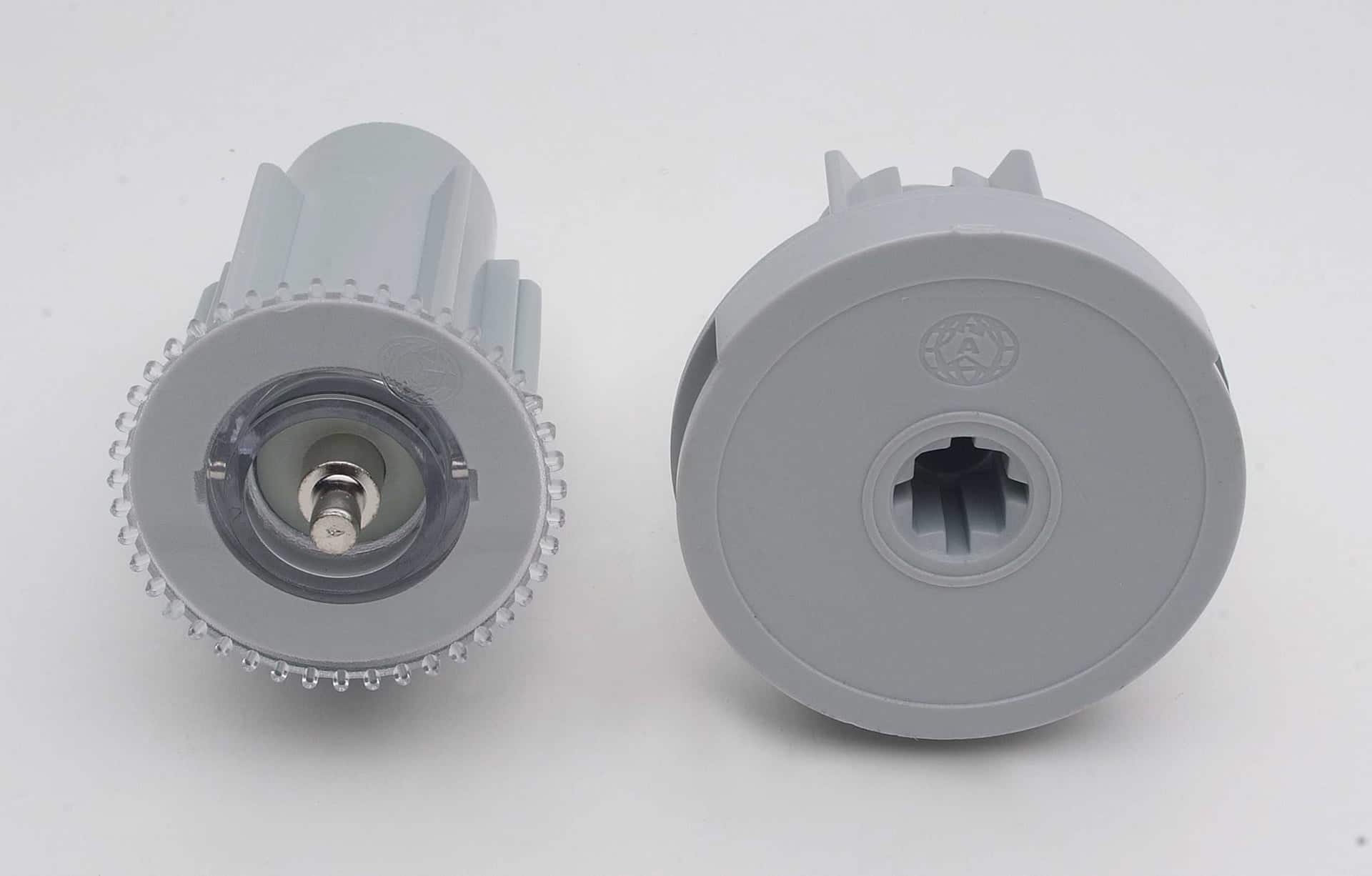 Roller blind end caps and clutch parts laid out for reassembly
