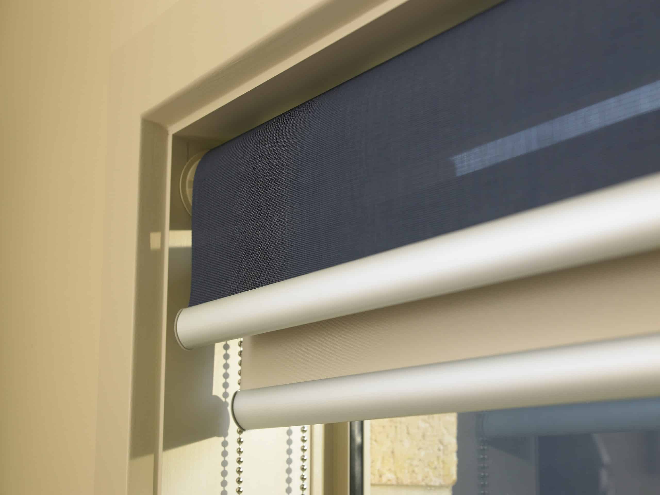 Navy roller blind fabric fitted above a window