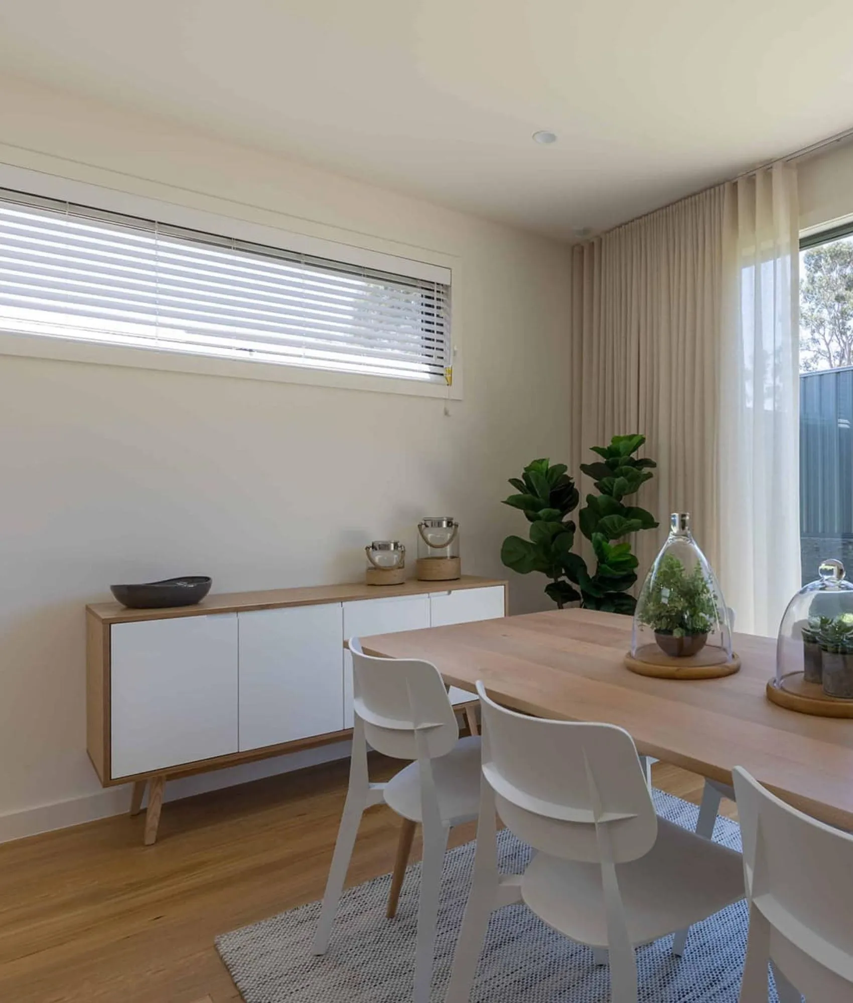 Venetian blinds fitted across a bank of windows