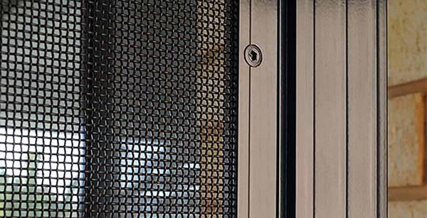Close-up of Crimsafe security mesh and door frame lock