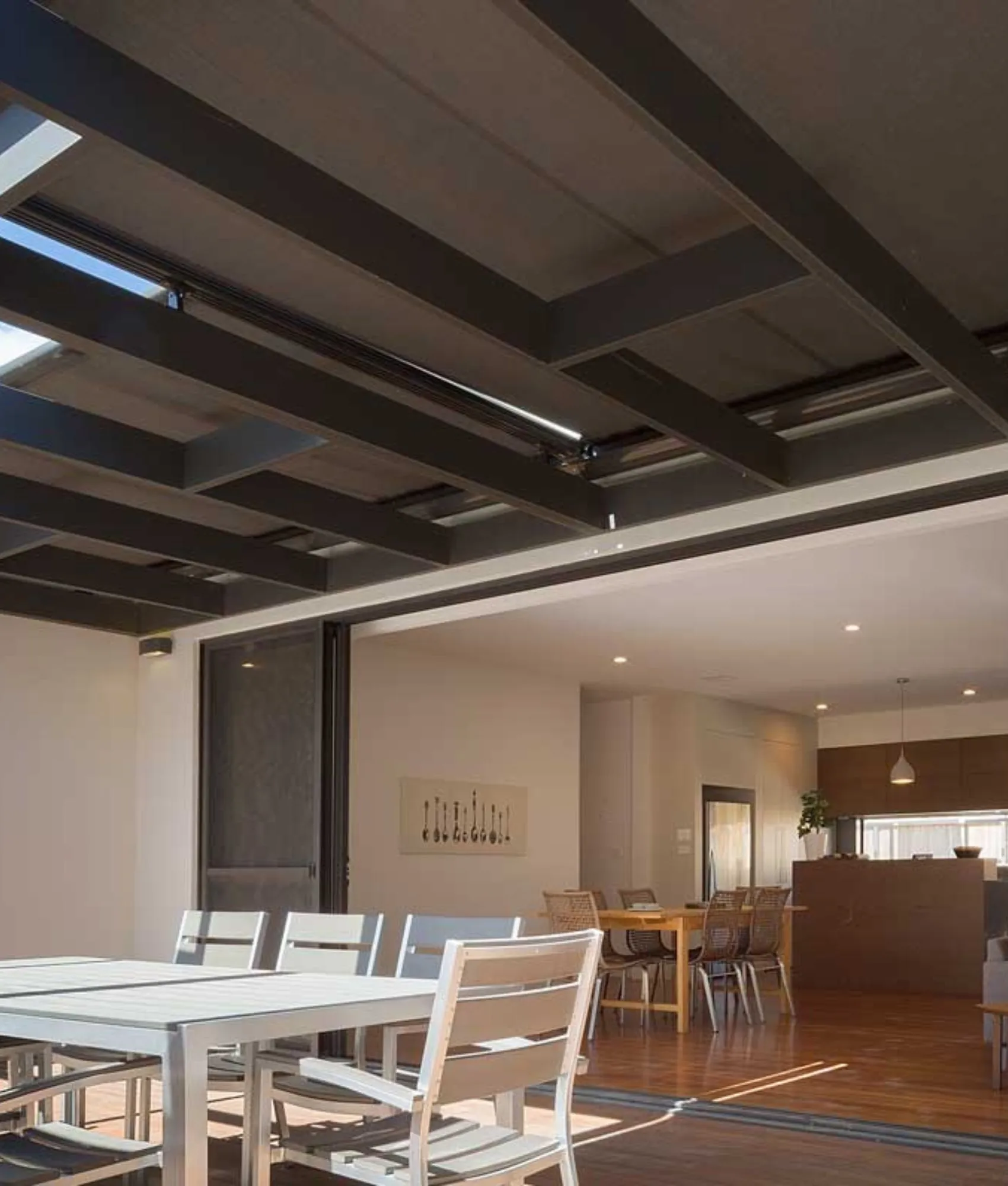 Sundream awning shading an outdoor dining area