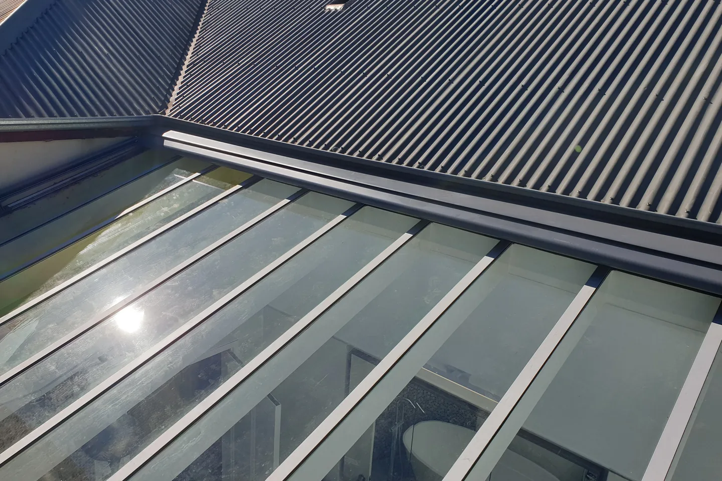 Glass roof with the Sundream awning retracted and the glazing bars exposed
