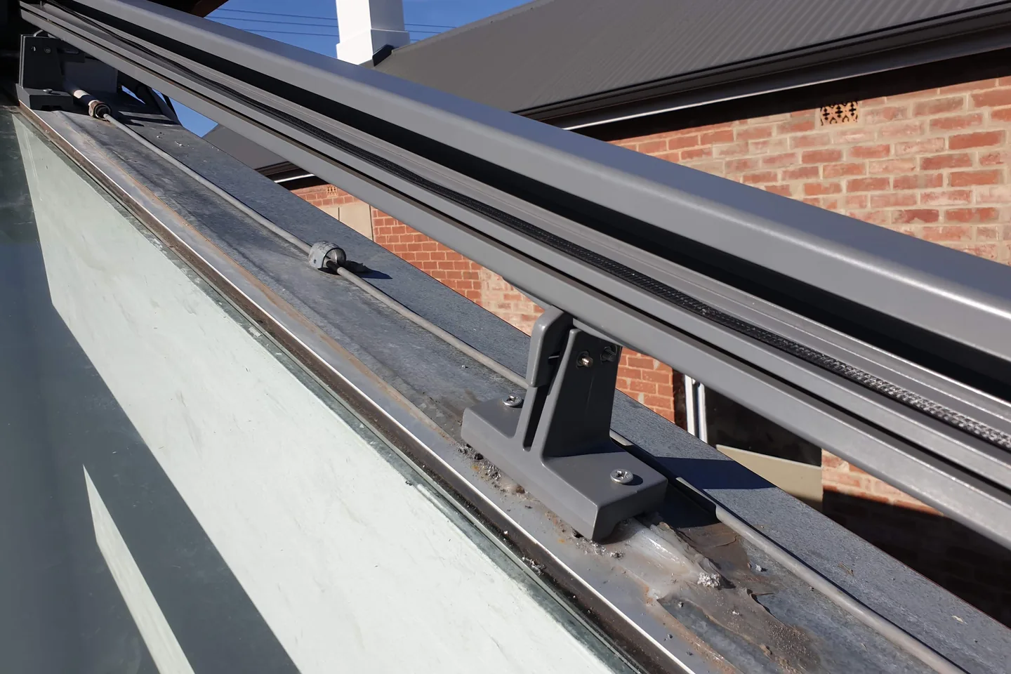 Sundream side rail running along the edge of a glass roof