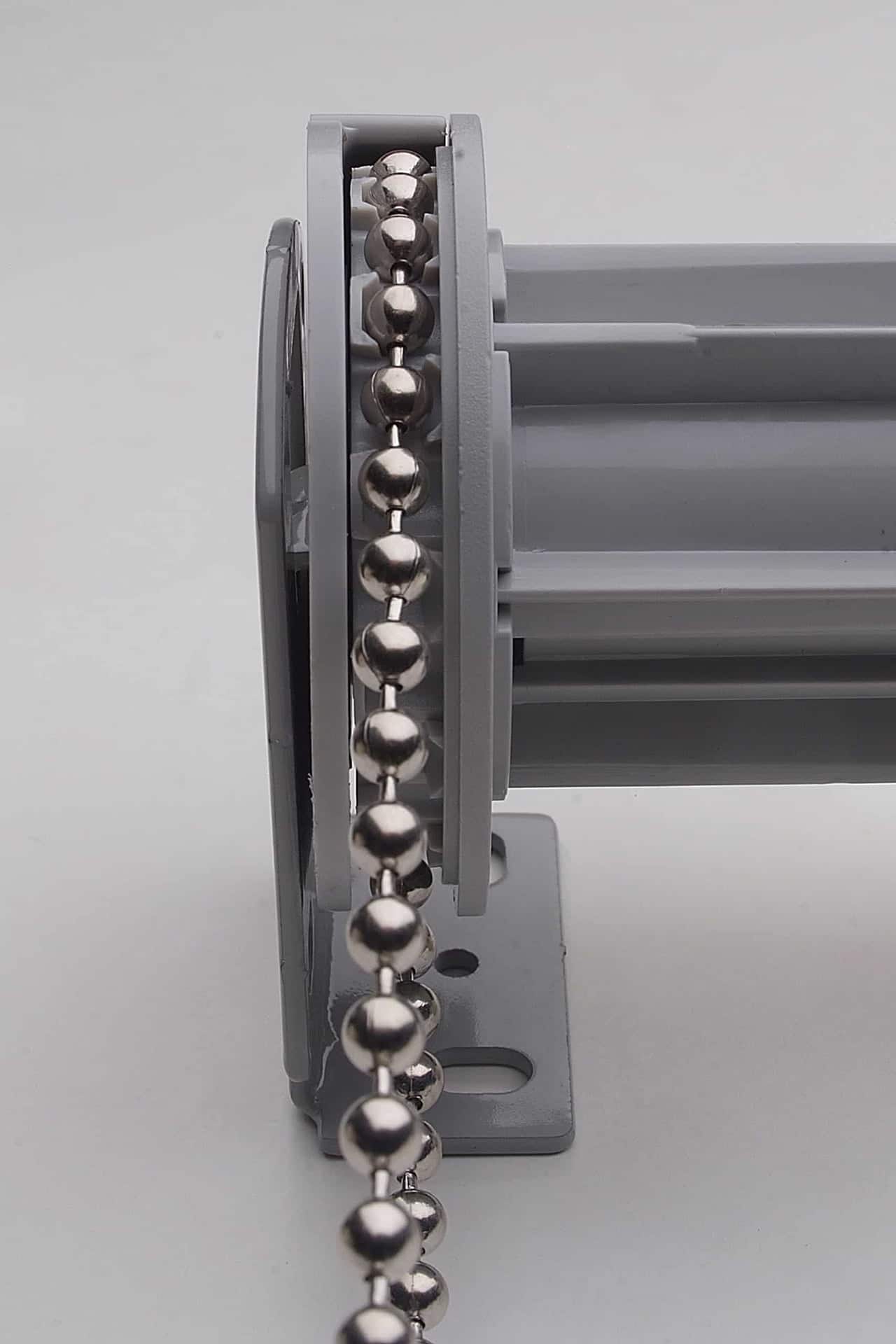 Roller blind bead chain fed through the wheel mechanism and wall bracket