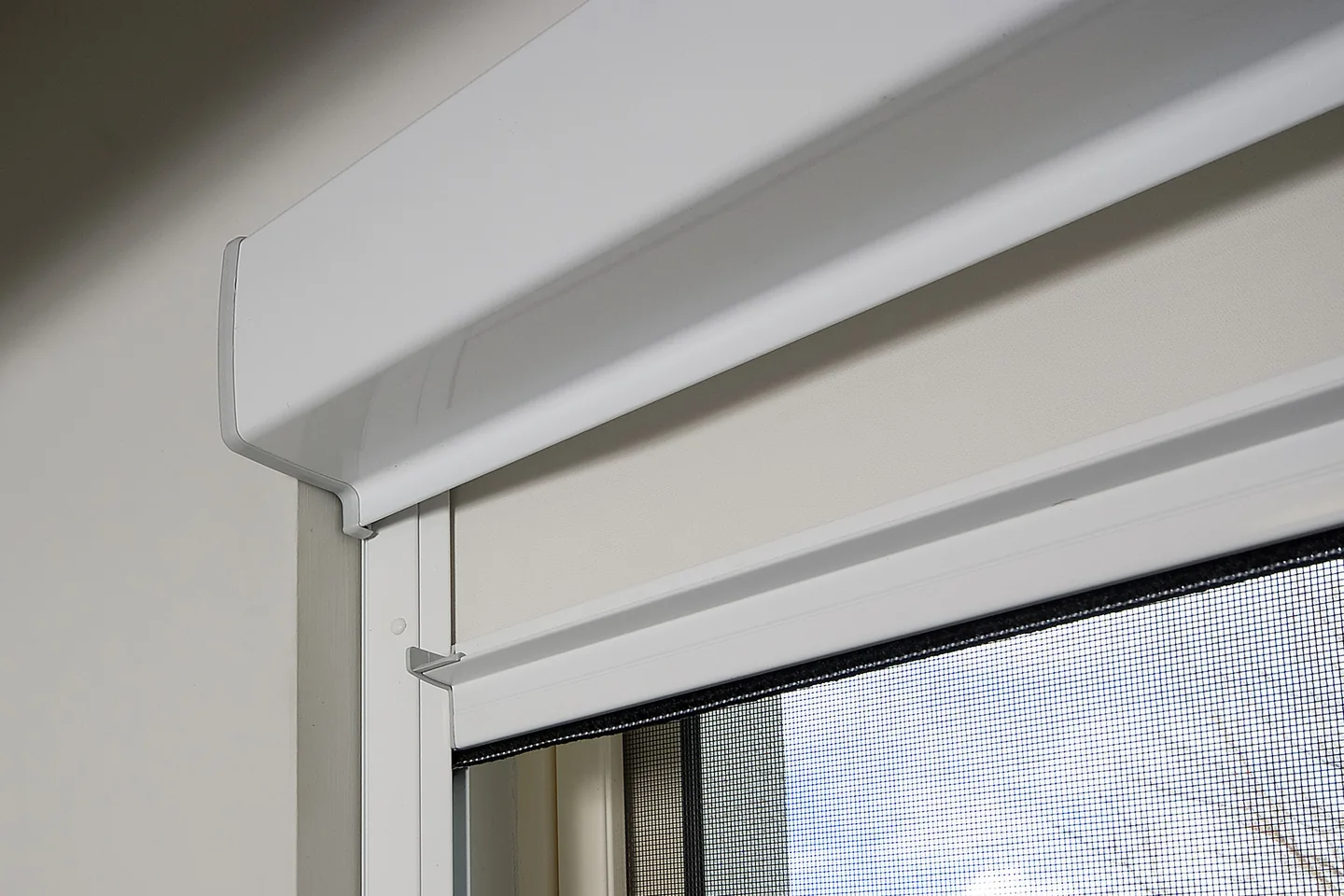 Close view of a Ziptrak Interior headbox and side track above a window