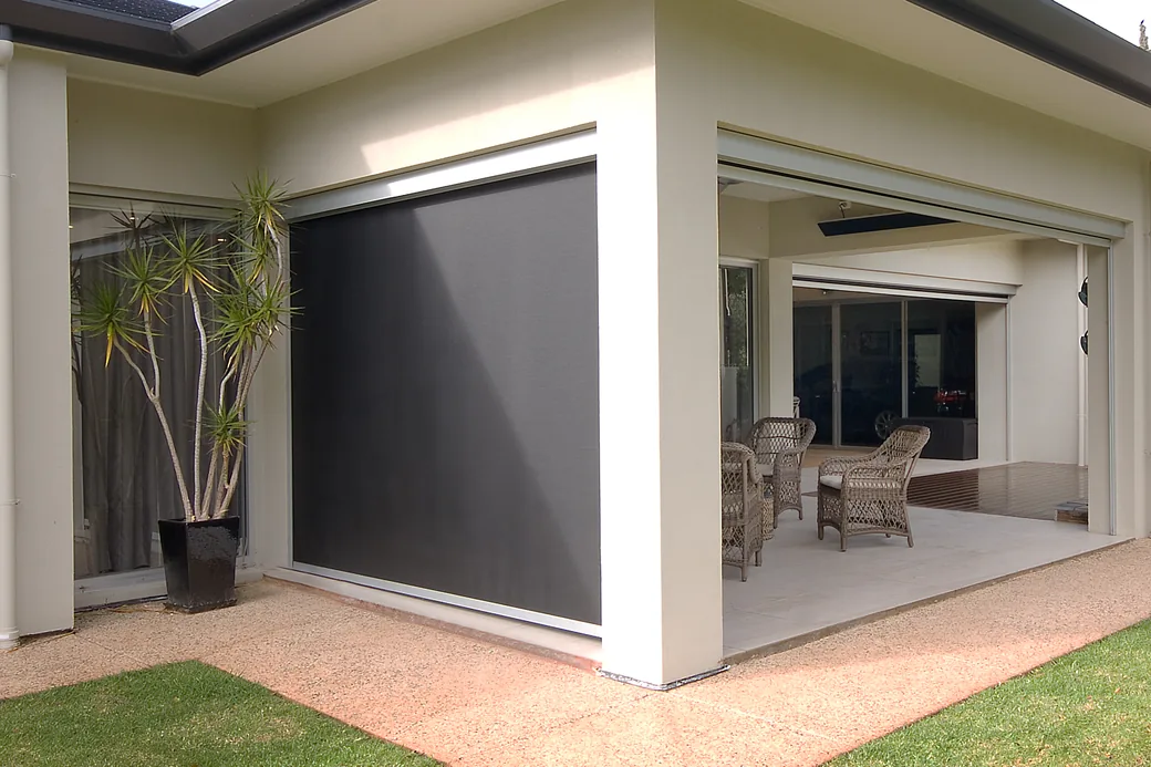 Rendered home with a Zipscreen outdoor blind lowered on one side of the alfresco and raised on the other